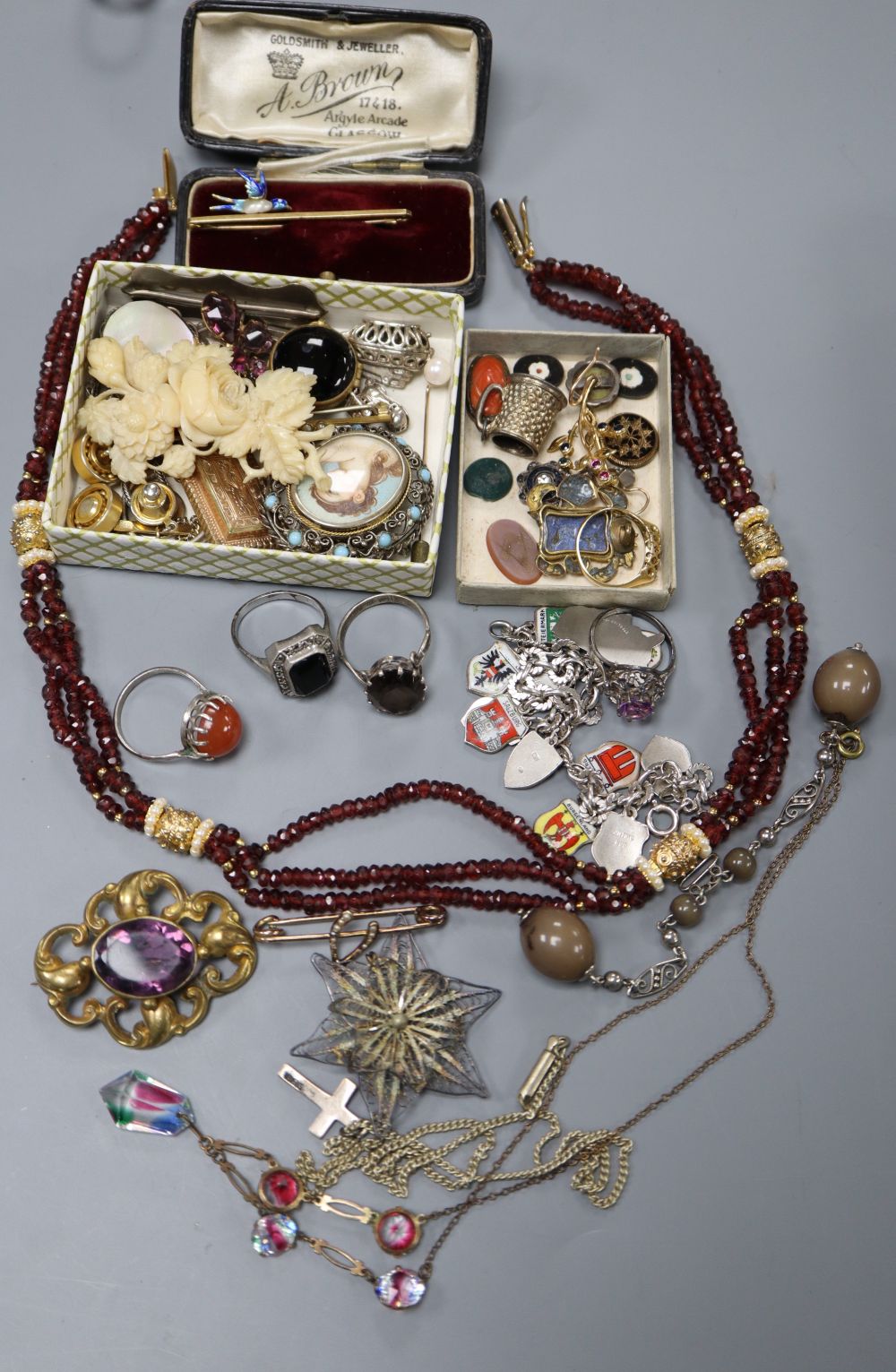 A 15ct, enamel and baroque pearl bird brooch, a.f. gross 3.4 grams, an 18ct and gem set ring, gross 1.9 grams & other jewellery.